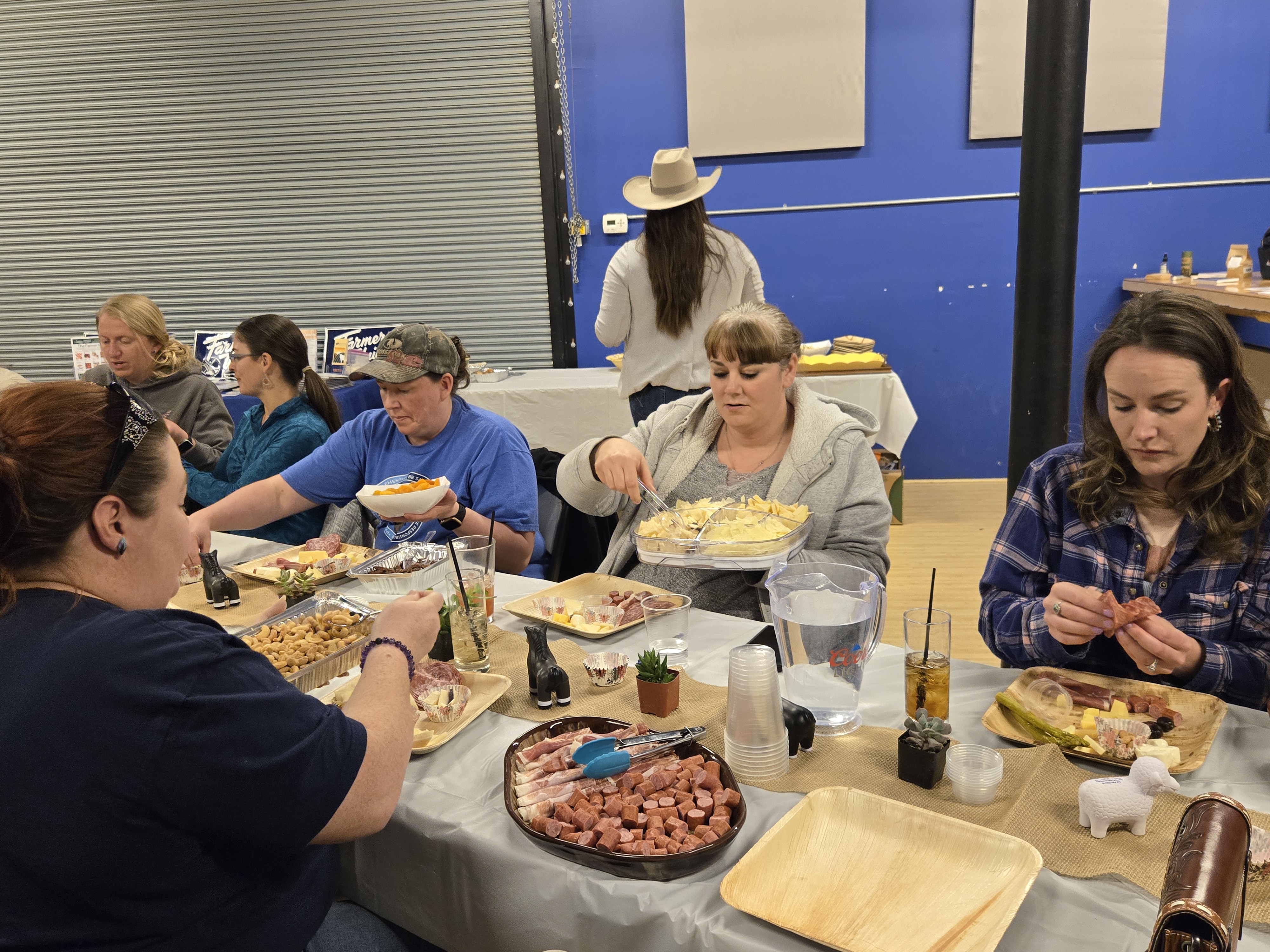 Participants in the Ladies Who Ag Wellness Workshop learn the art of charcuterie boards.